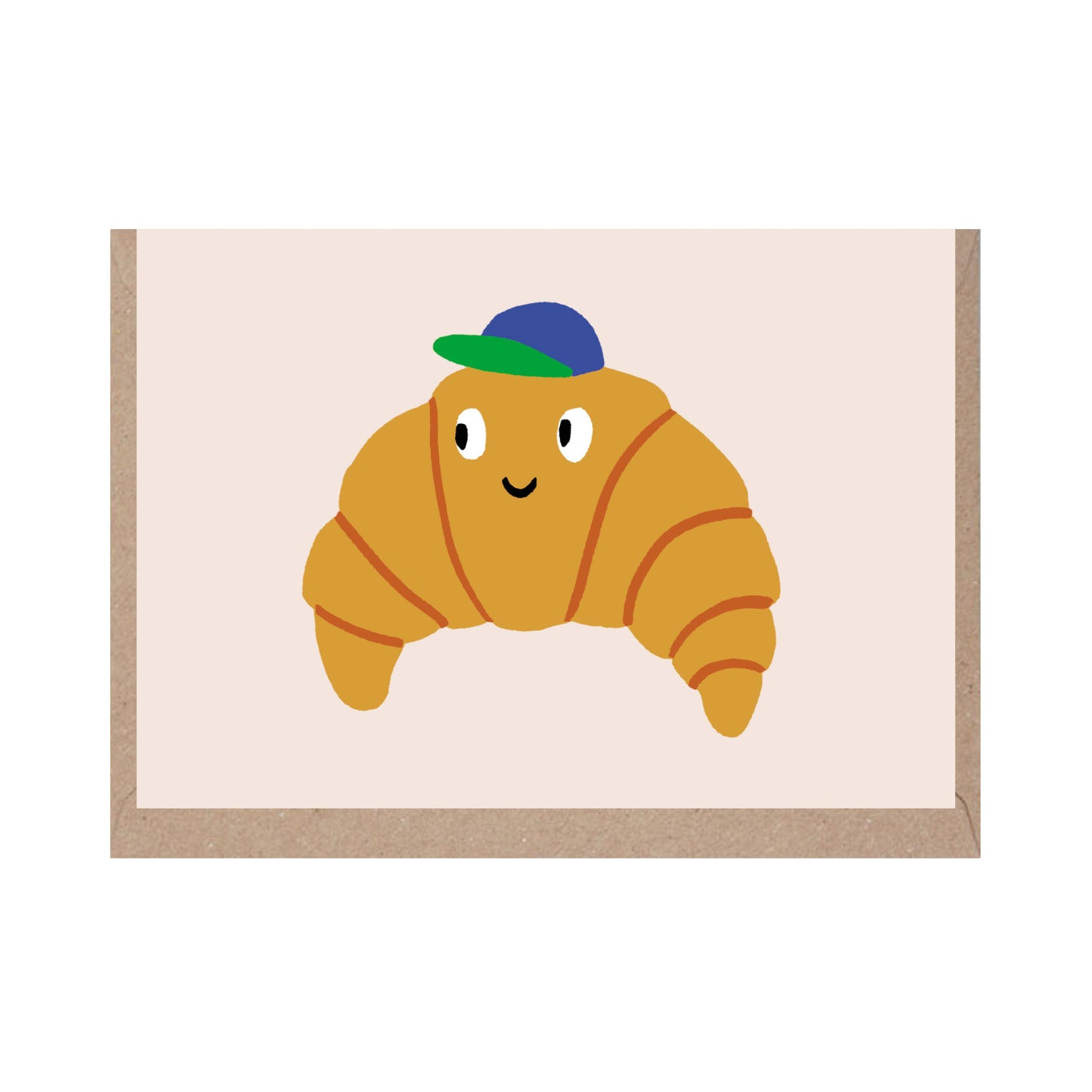 mini greeting card with a croissant wearing a blue and green baseball cap on it 