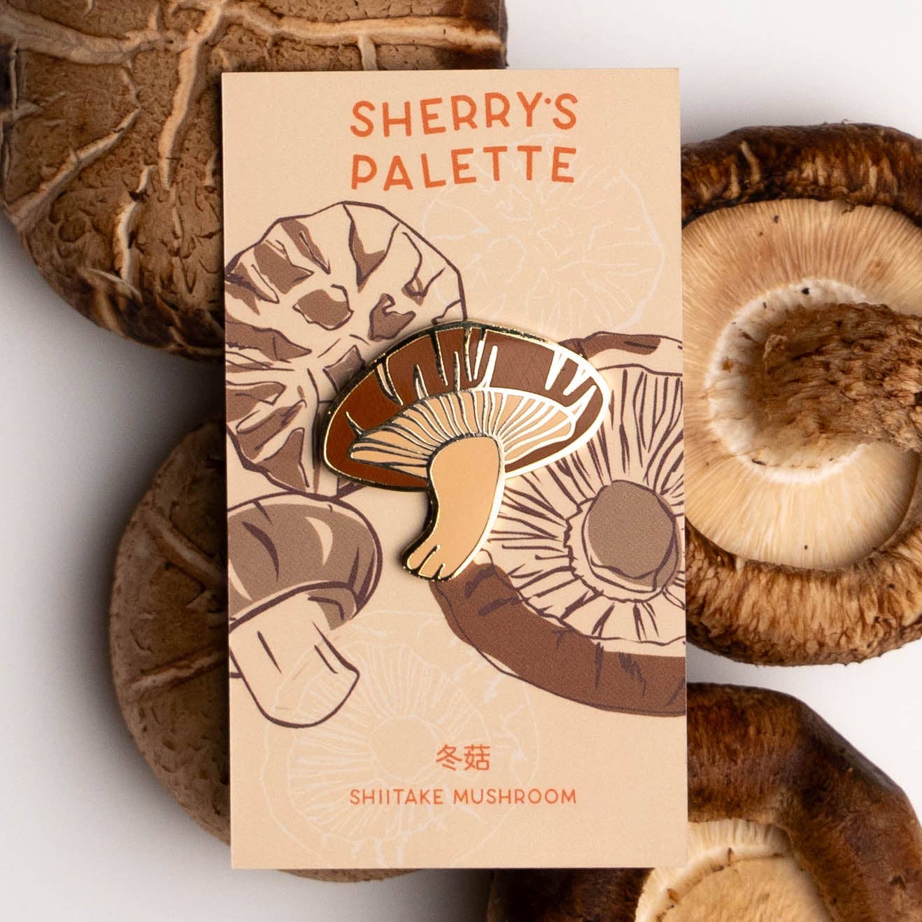 Mushroom enamel pin on card backing 