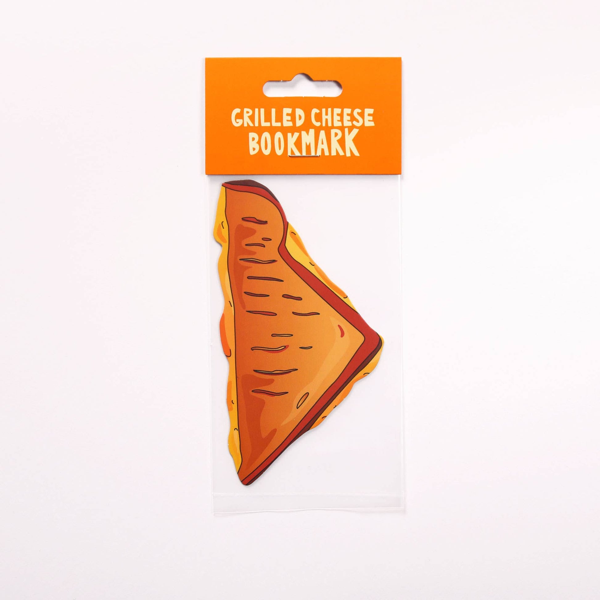 bookmark that looks like a triangle shaped half of a grilled cheese sandwich in it's packaging 
