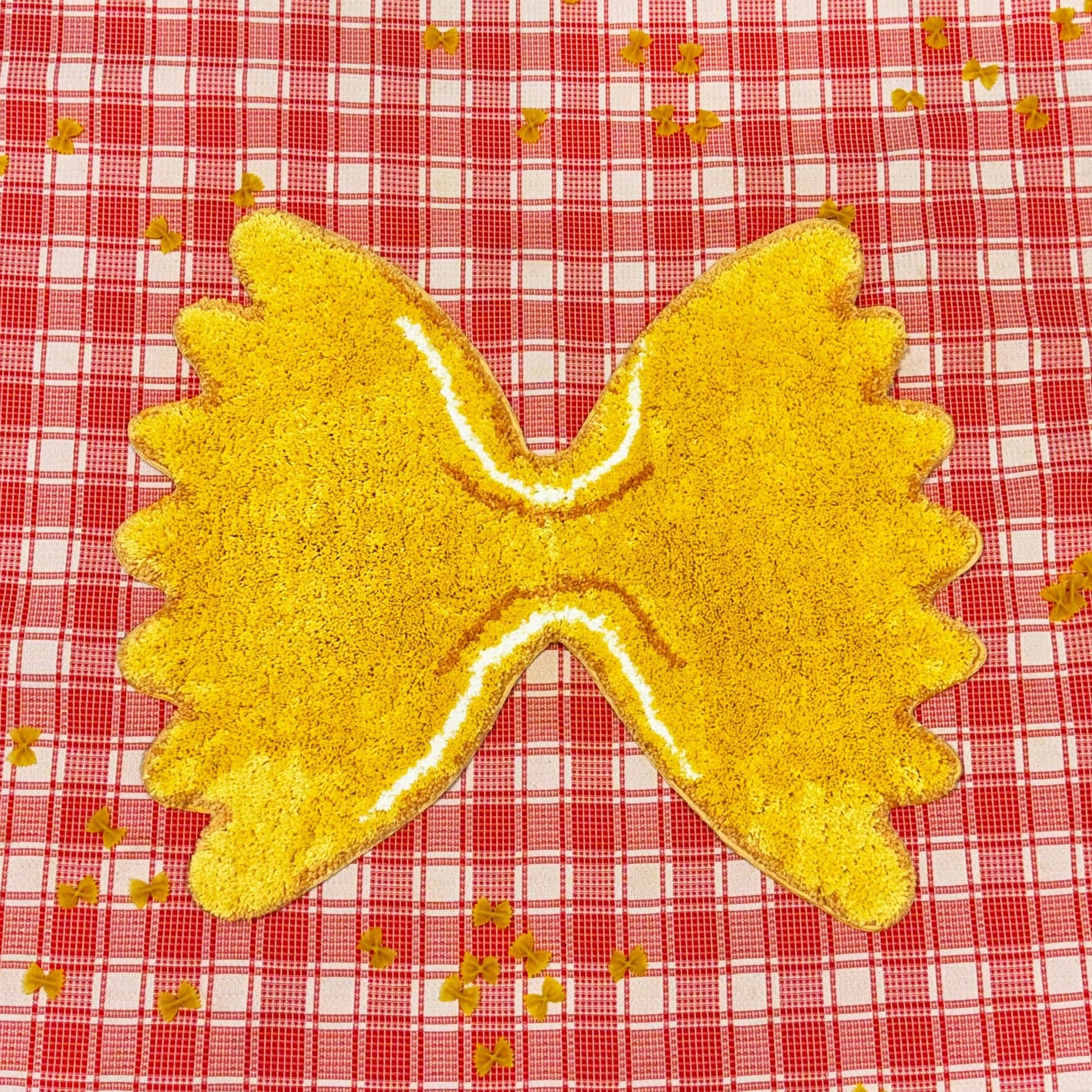 Rug in the shape of a farfalle (butterfly/bowtie) pasta