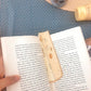 Block of cheese bookmark being used inside book 