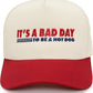 Cap with 'It's a bad day to be a hot dog' text on a white background