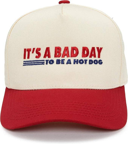 Cap with 'It's a bad day to be a hot dog' text on a white background