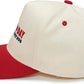 Baseball cap with red brim and white bill featuring a logo on a white background