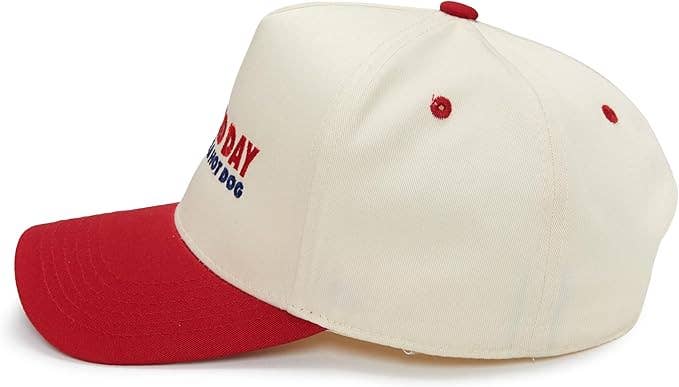 Baseball cap with red brim and white bill featuring a logo on a white background