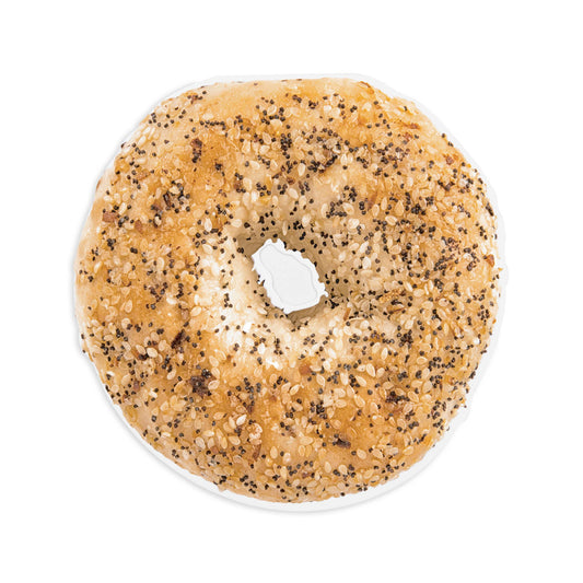 Bagel with sesame seeds and poppy seeds on a white background. Notepad