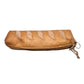 Side view of the baguette pouch to show zipper and charm/ chain detail.