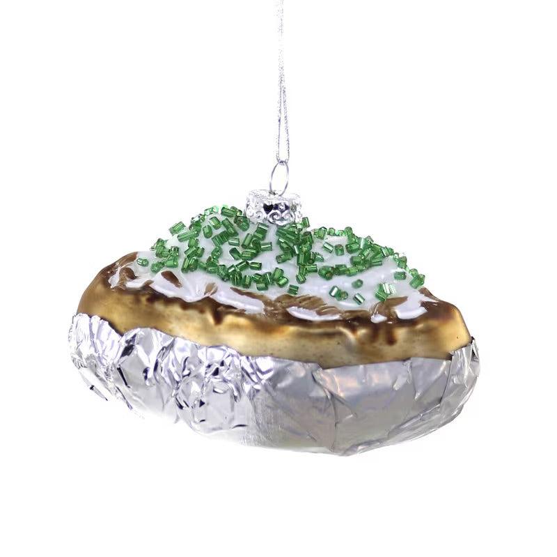 Glass ornament that looks like a baked potato topped with sourcream and chives made out of green beads.