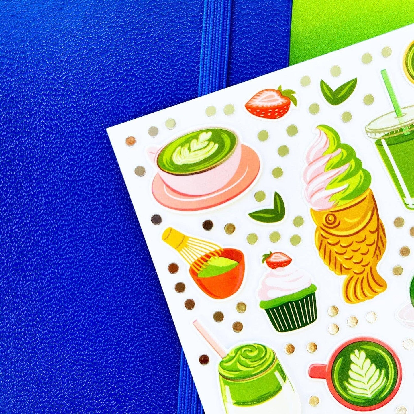 Sheet of colorful matcha-themed stickers on a blue background