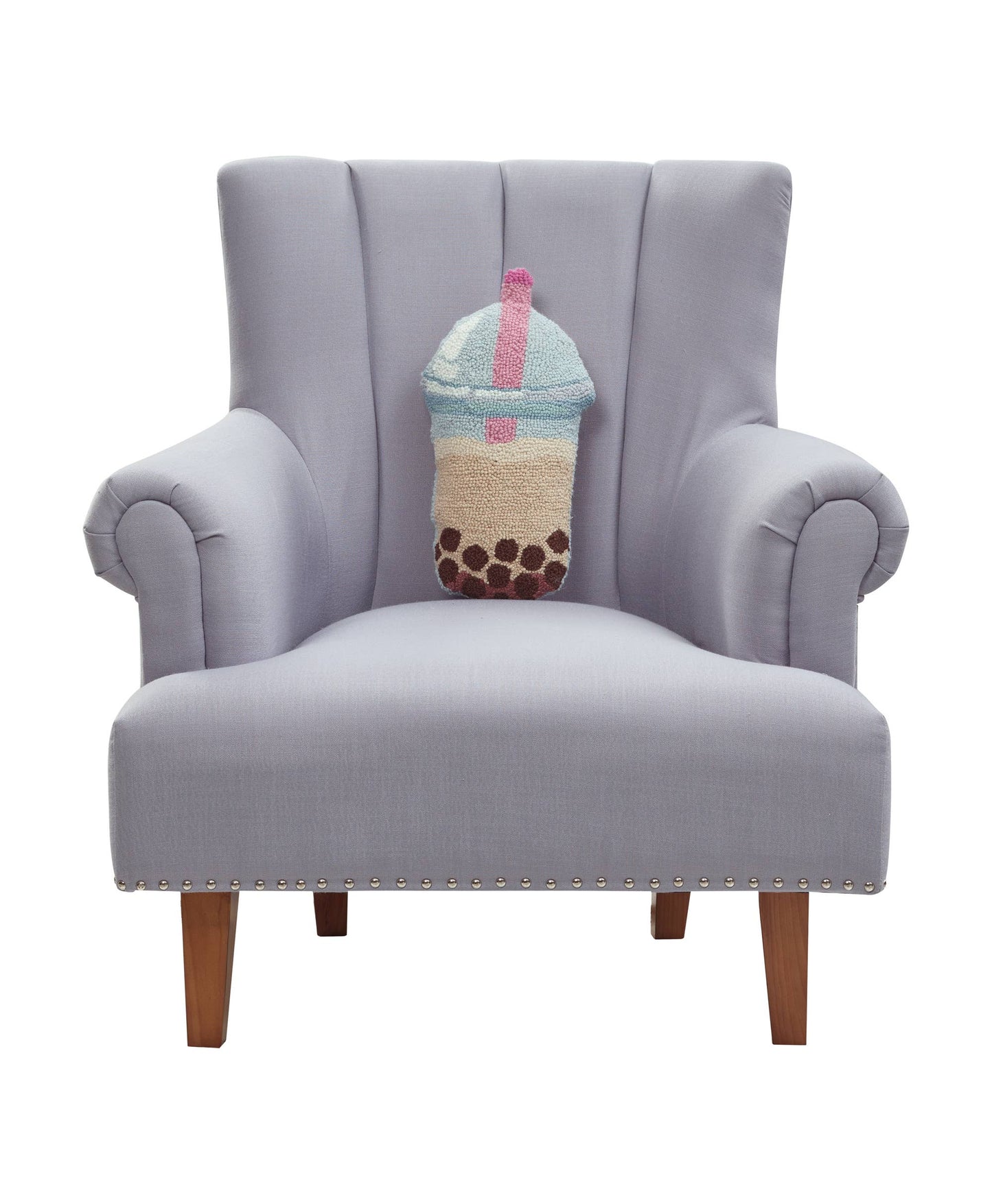 Gray armchair with a decorative pillow shaped like a boba drink on a white background