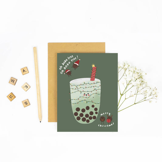 Christmas-themed greeting card with a bubble tea illustration on a white background