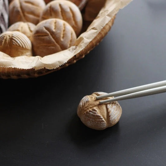 chopstick holder that looks like a mini round loaf of bread 