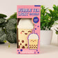 Bubble tea-themed light in packaging with plants in the background