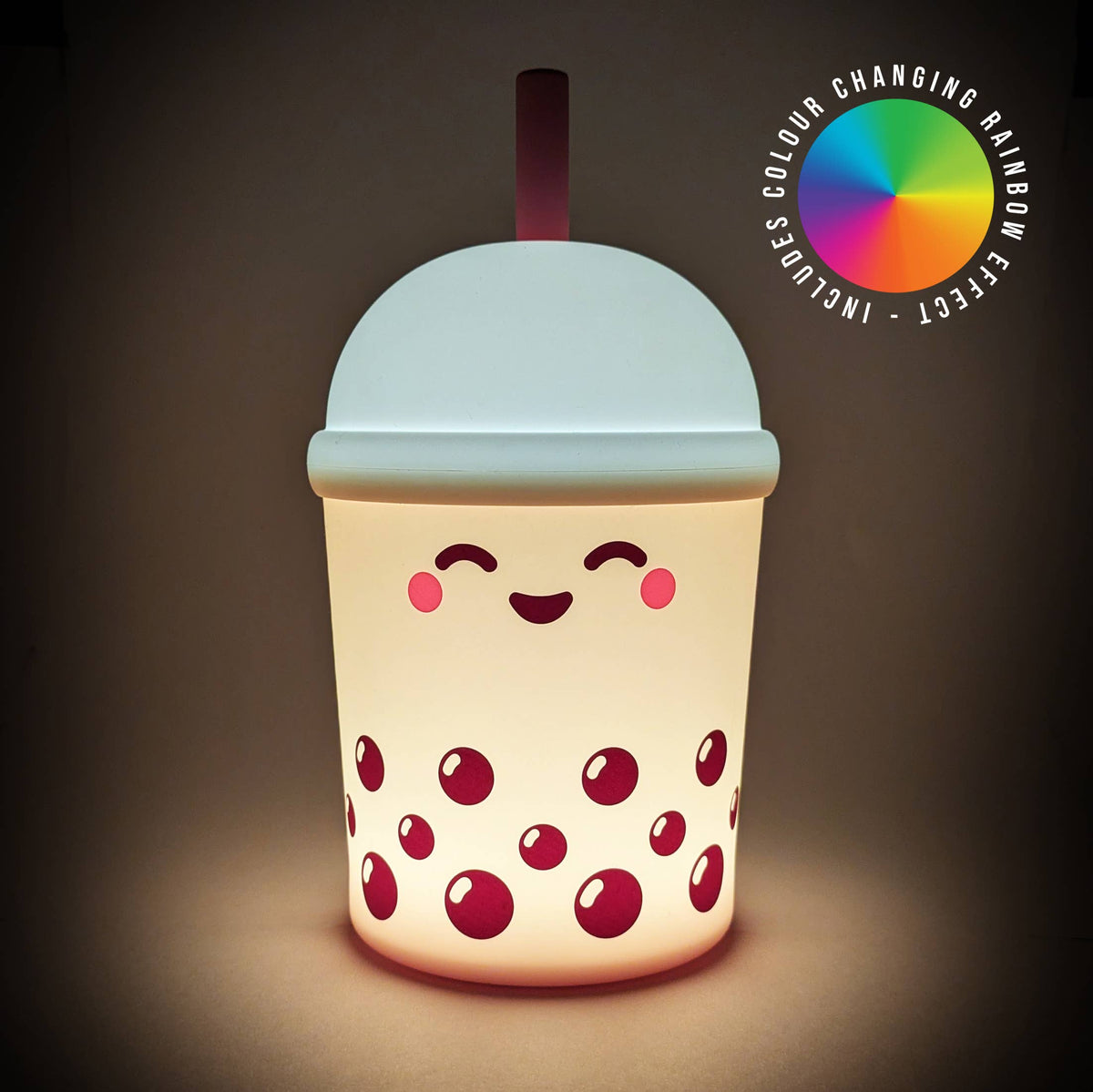 A cute boba tea cup shaped night light glowing with warm light, featuring a smiling face and red bubble details, with a color-changing rainbow effect badge in the top right corner.