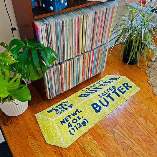 Tufted rug made to look like a stick of salted butter