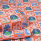 Patterned gift wrap with cartoon characters and food items on a checkered background