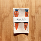 Packaged towel with cartoon carrots on a wooden surface