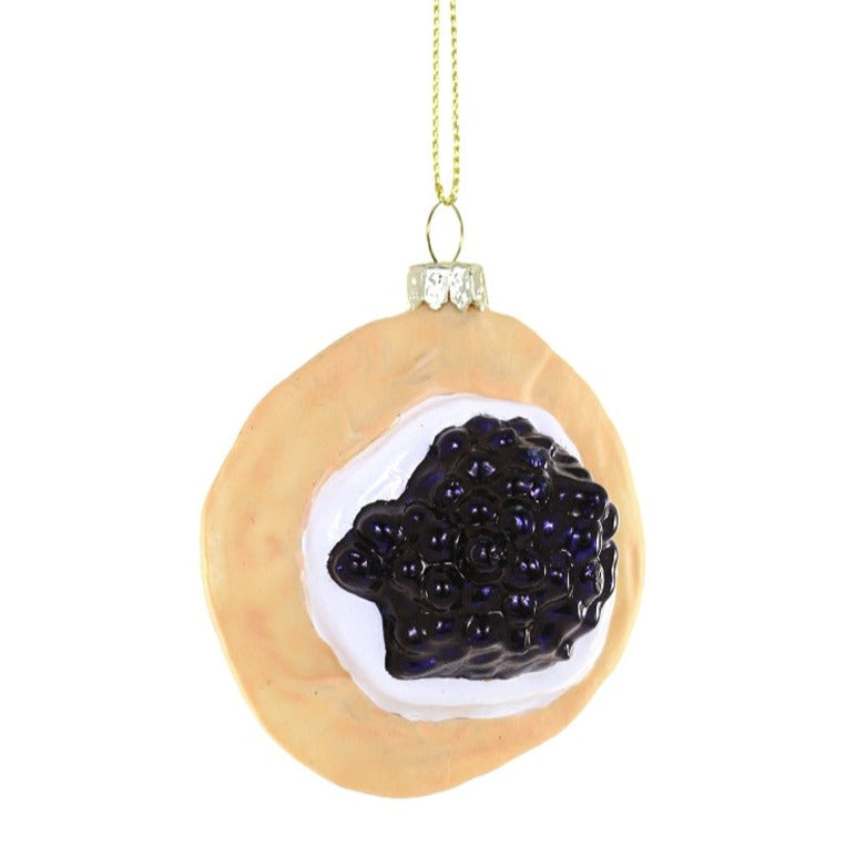 Caviar and creme fraiche on a blini as an ornament.