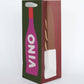 Wine bottle designed gift bag with a purple bottle and green label on a white background