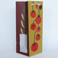 Product packaging with bread and tomato design on a white background