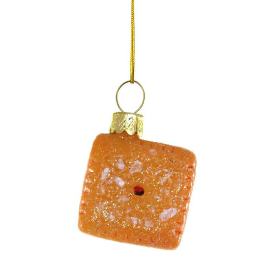 Mini glass ornament that looks like a single cheese it with glitter.