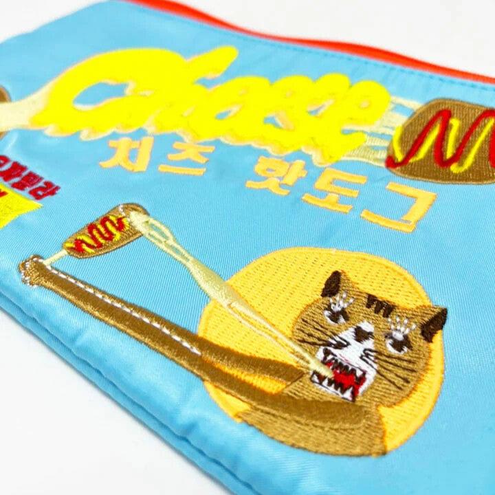 Baby blue pouch with a cat eating a cheese corndog. Text reads Cheese with korean text underneath.