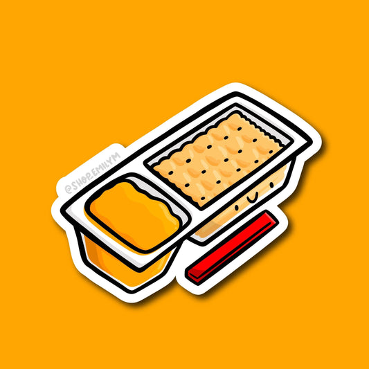 A stylized die-cut sticker of a cracker and cheese dip with the red plastic spreader stick shown on a solid orange background.
