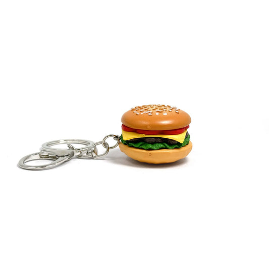 Keychain shaped like a cheeseburger with sesame seed bun, tomato, sliced cheese, burger and lettuce. Metal clasp.
