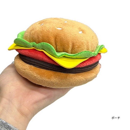 Pouch that looks like a cheeseburger complete with tomato, lettuce and cheese. Bun has sesame seeds.