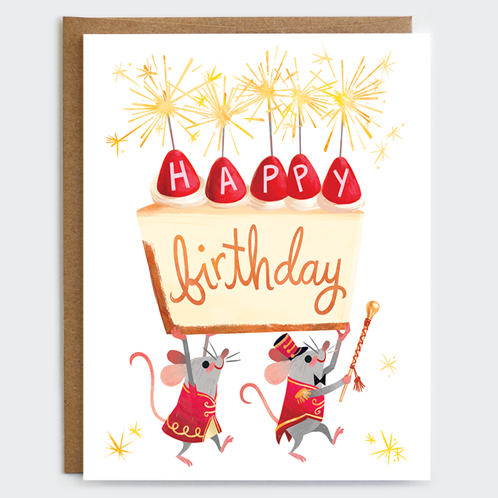 Greeting card with illustration of mice dressed in red marching band attire carrying a piece of cheesecake over their heads with text "Happy Birthday" written on the side, and strawberries and sparklers on top.