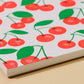 close up of cherry patterned doodle book 