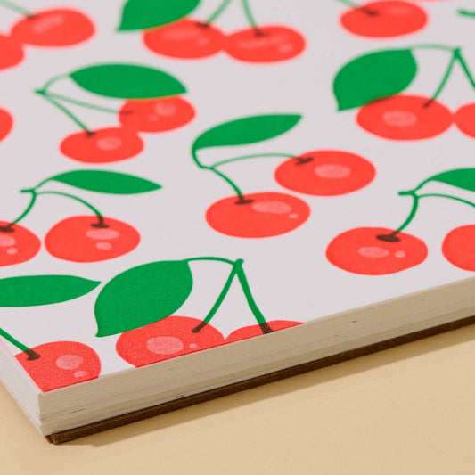 close up of cherry patterned doodle book 
