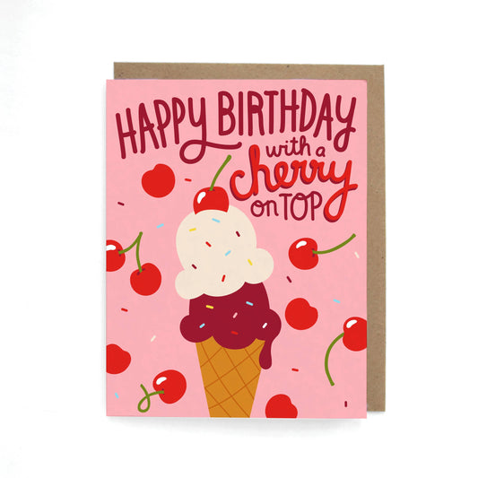 Birthday card with ice cream cone and cherry design on a pink background