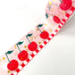 pink washi tape with gold foil accents and red cherries on it 