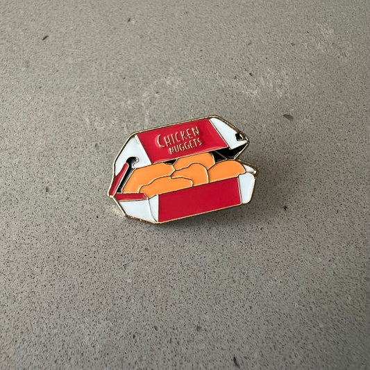 Chicken Nugget Lapel Pin. Red and white box with 5 nuggets inside. The box reads Chicken Nuggets