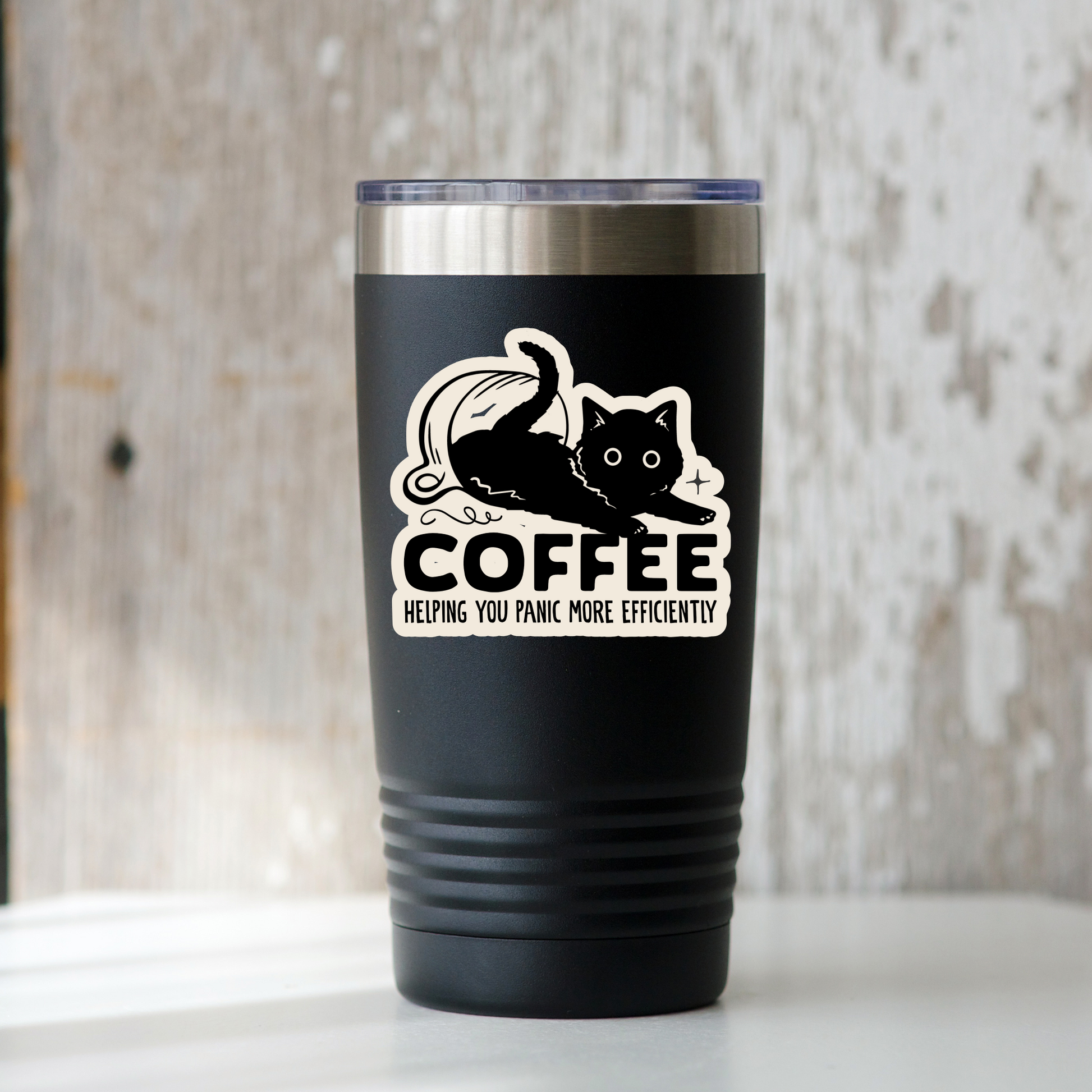A black insulated travel tumbler with a clear lid and a white graphic of a cat with the text 'COFFEE HELPING YOU FUNK MORE EFFICIENTLY' stands on a white surface against a rustic distressed wood background.