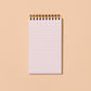 Notebook with blank pages on a beige background