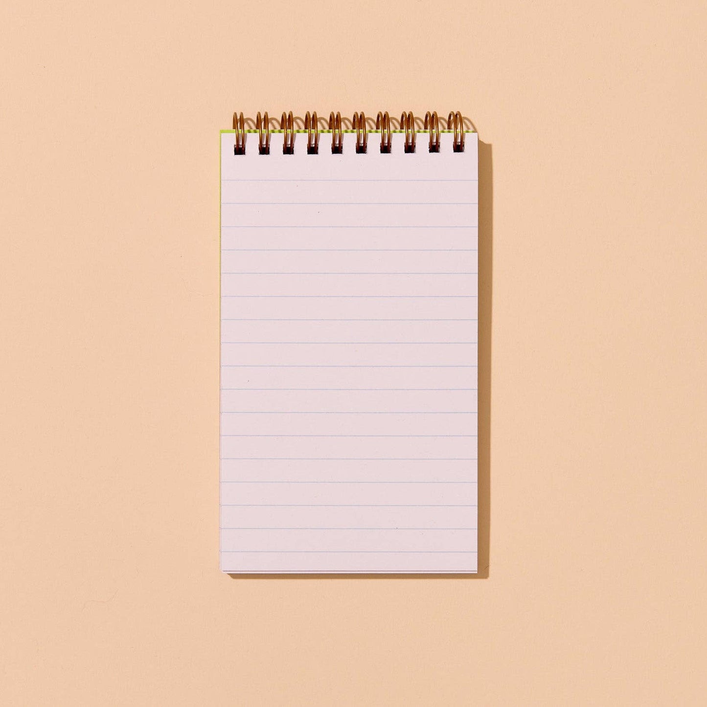 Notebook with blank pages on a beige background