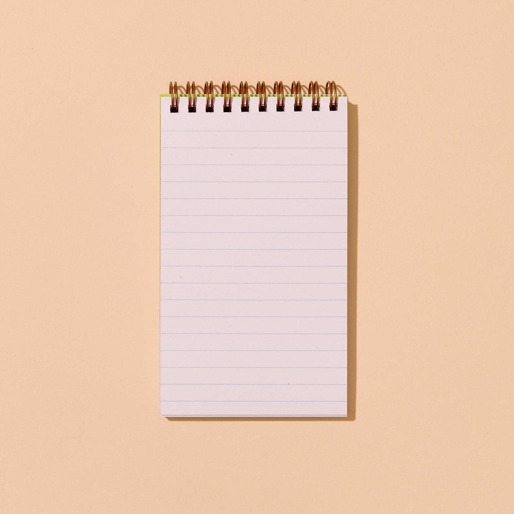 Notebook with blank pages on a beige background