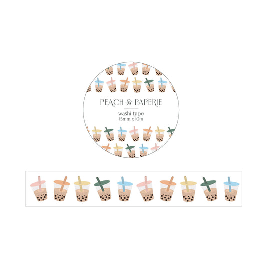 washi tape with white background and boba cups with different colored lids and straws