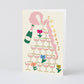 Greeting card with champagne bottle, glasses, and flowers on a beige background