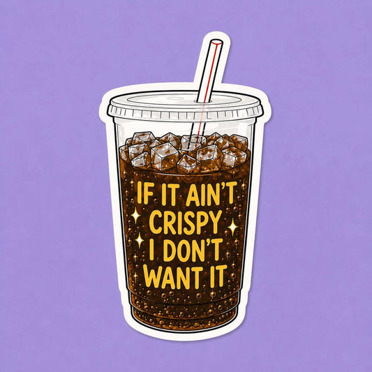 A die-cut vinyl sticker of a clear plastic cup filled with iced coffee and a red-and-white striped straw, with the phrase “IF IT AIN’T CRISPY I DON’T WANT IT” in yellow lettering, shown on a solid lavender background.