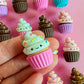 Small cupcake-shaped magnet with faces on a pink background