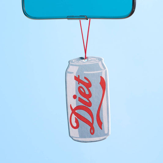 A novelty car rearview mirror ornament featuring a silver aluminum Diet Coke can with the red script logo, hanging from a blue mirror by a red string against a light blue background.