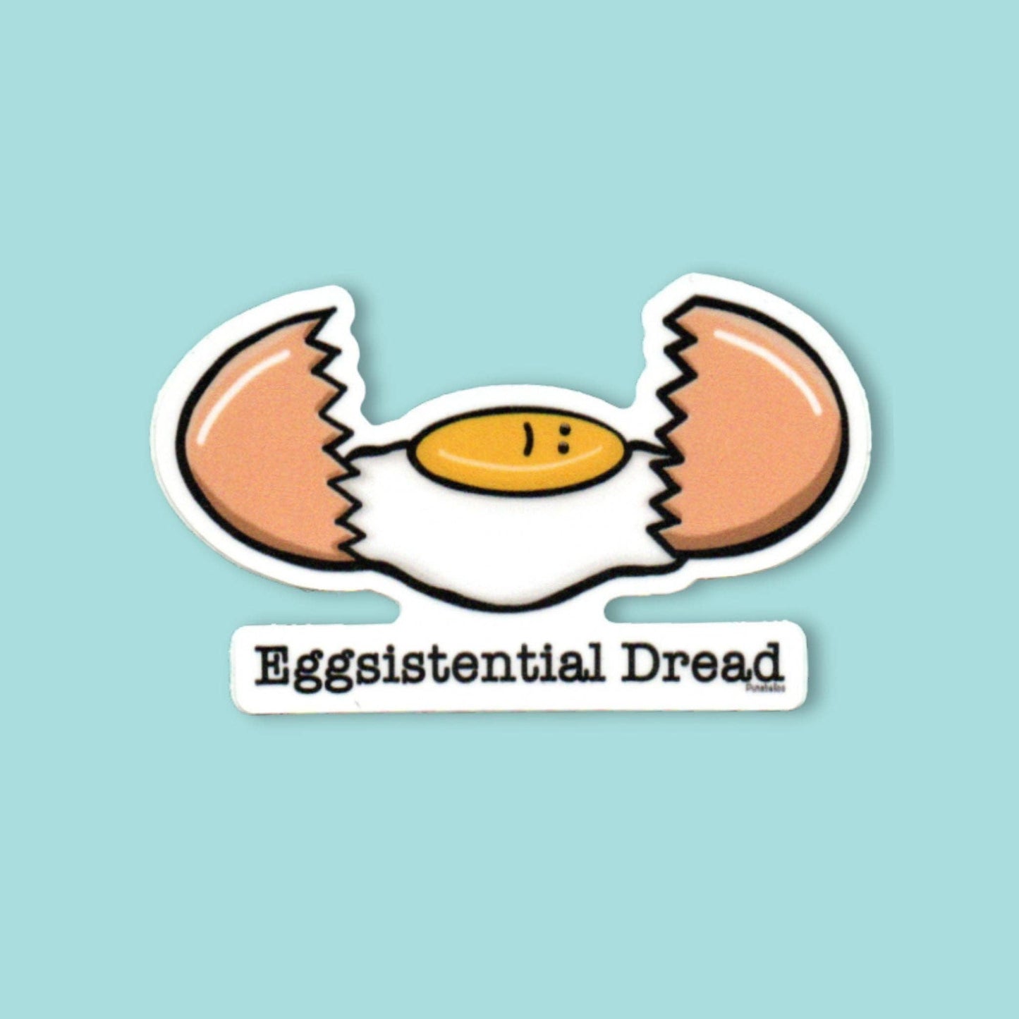 A die-cut sticker featuring a cartoon cracked egg with the text 'Eggsistential Dread' underneath, shown on a solid light blue background.