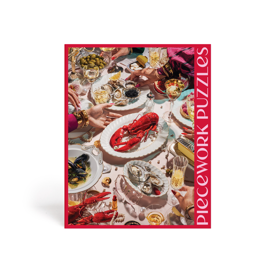 Puzzle called "Fancy Ideas" in a red box. The image of the puzzle is a fancy feast of seafood, caviar, martinis and champagne.