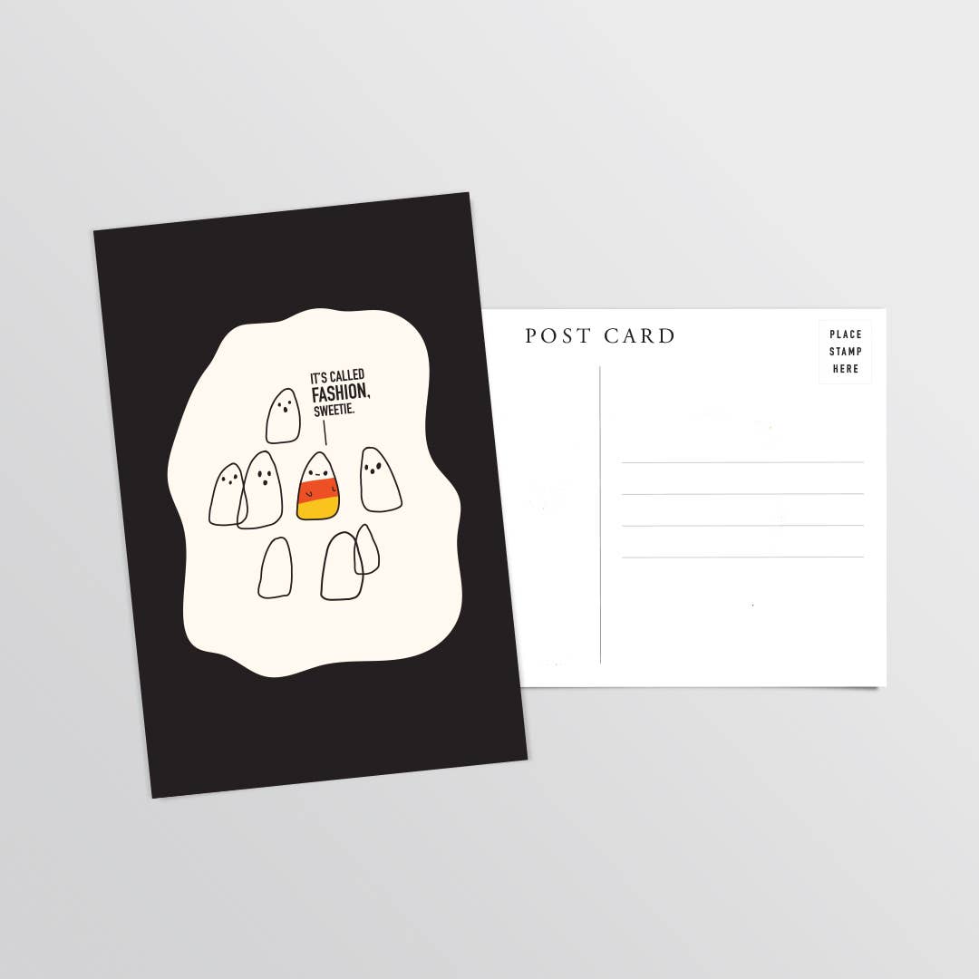 A postcard product shown on a light gray background, with one front-facing postcard featuring a black background, with simple ghost illustrations including one in orange, yellow, and white, like a candy corn, and a second blank postcard behind it with printed postcard text.