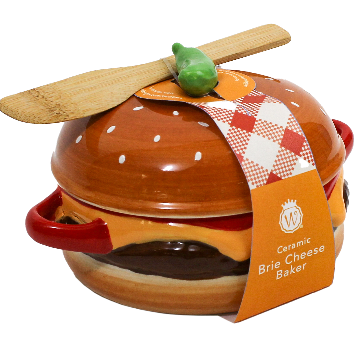 A ceramic brie cheese baker shaped like a hamburger, with a wooden spatula resting on top and a paper tag reading 'Ceramic Brie Cheese Baker' on a white background.