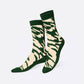 A pair of crew socks with a green and beige zebra-like stripe pattern, shown against a plain light gray background.