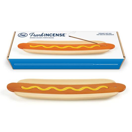 A ceramic hot dog incense holder  shown below its blue and white retail box. The brand 'Fred' and product line 'Frankincense' are visible on the packaging.